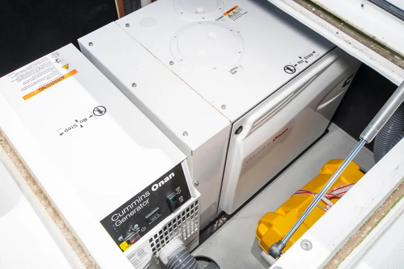 Slide: The Image of Cummins Onan generator in a 2017 Lagoon 42 yacht engine compartment. - 24