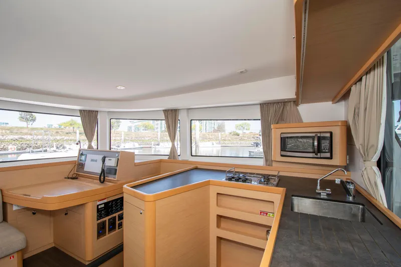 Slide: The Image of Interior of 2017 Lagoon 42 yacht with modern kitchen and navigation area. - 36