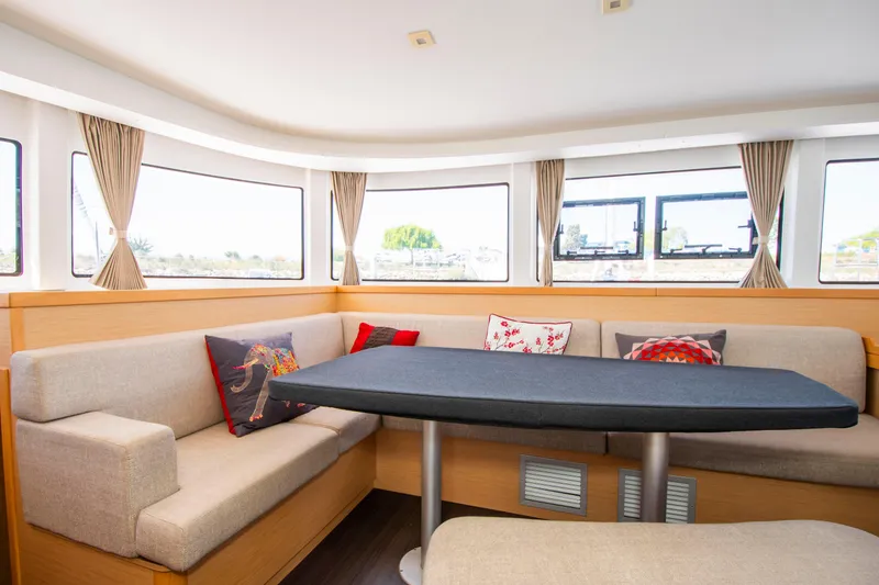 Slide: The Image of Interior of 2017 Lagoon 42 catamaran with cozy seating and large windows. - 40