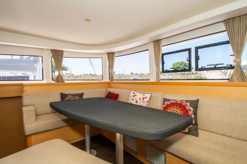 Slide: The Image of Interior of 2017 Lagoon 42 catamaran with cozy seating and large windows. - 41