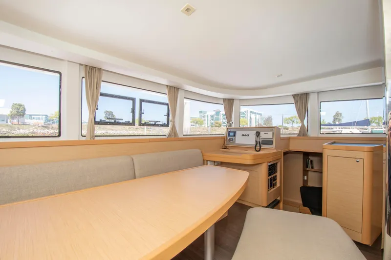Slide: The Image of Interior of 2017 Lagoon 42 catamaran with spacious seating and navigation equipment. - 44