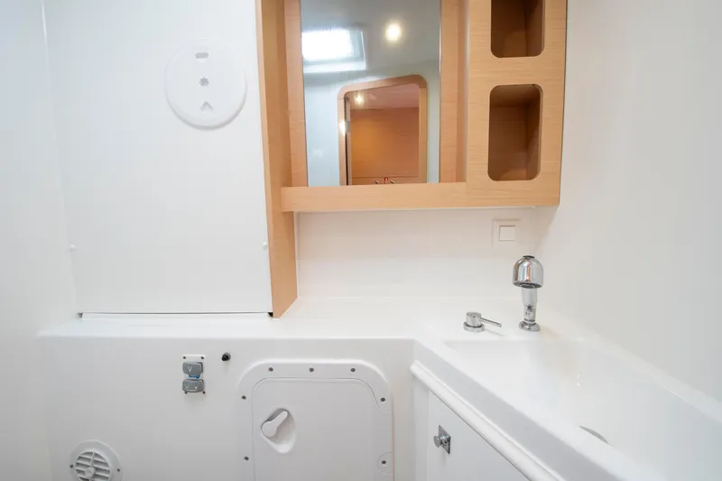 Slide: The Image of 2017 Lagoon 42 yacht bathroom with modern sink and storage cabinets. - 48