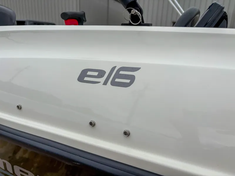Slide: The Image of Bayliner Element E16 boat, 2020 model, close-up of logo on white hull. - 12