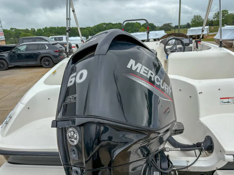 Slide: The Image of 2020 Bayliner Element E16 with Mercury 60 HP outboard engine, parked outdoors. - 4