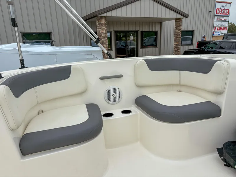 Slide: The Image of 2020 Bayliner Element E16 boat interior with gray and white seating. - 6