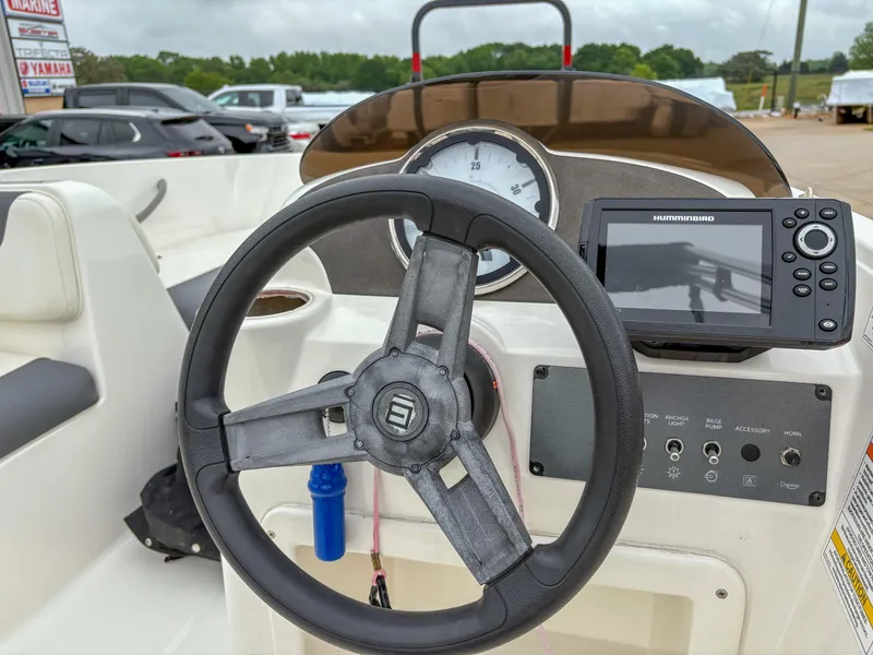 Slide: The Image of 2020 Bayliner Element E16 dashboard with steering wheel and navigation system. - 7