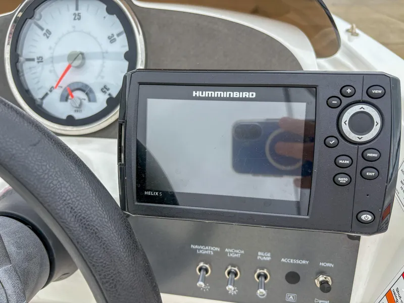 Slide: The Image of Dashboard of 2020 Bayliner Element E16 with Humminbird Helix 5 GPS and controls. - 8