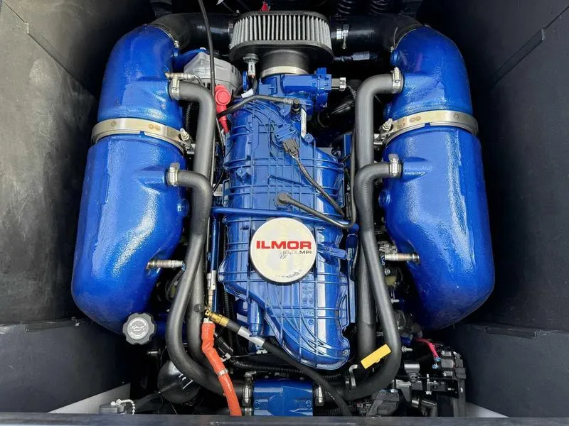 Slide: The Image of 2022 MasterCraft XT23 Ilmor engine, blue components, high-performance marine motor. - 15