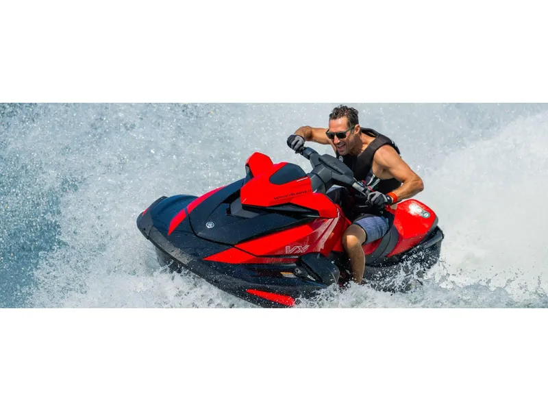 Slide: The Image of 2024 Yamaha VX Limited jet ski speeding on water, rider enjoying the thrill. - 11