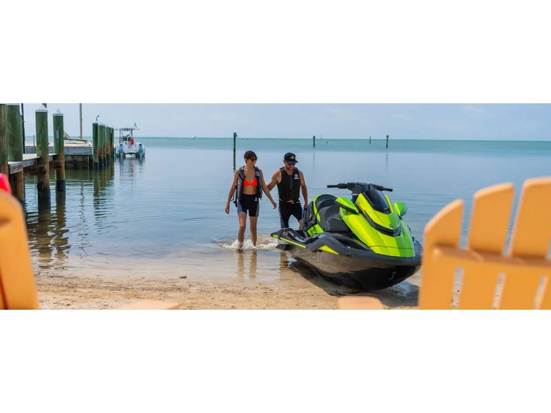 Slide: The Image of 2024 Yamaha FX Cruiser SVHO with Audio on beach, two people in life vests. - 10