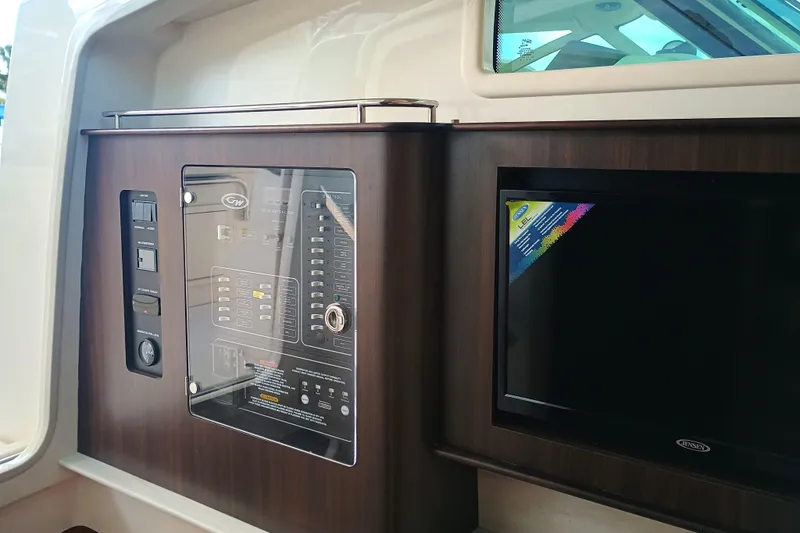 Slide: The Image of Control panel and screen inside 2025 Grady-White Canyon 386 boat cabin. - 23