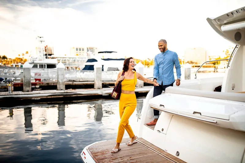 Slide: The Image of Couple enjoying a day on a 2025 Prestige 420S yacht at the marina. - 11