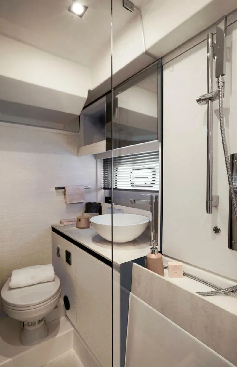 Slide: The Image of Luxurious bathroom in 2025 Prestige 420S yacht, featuring modern fixtures and elegant design. - 14
