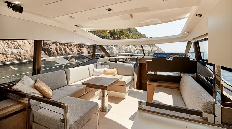Slide: The Image of Luxurious interior of 2023 Prestige 460S yacht with elegant seating and scenic ocean view. - 5