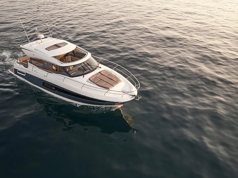 Slide: The Image of 2023 Prestige 460S yacht cruising on calm ocean waters. - 10