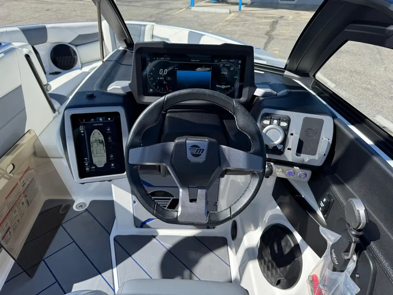 Slide: The Image of 2024 Malibu Wakesetter 23 LSV dashboard with modern controls and touchscreen displays. - 11