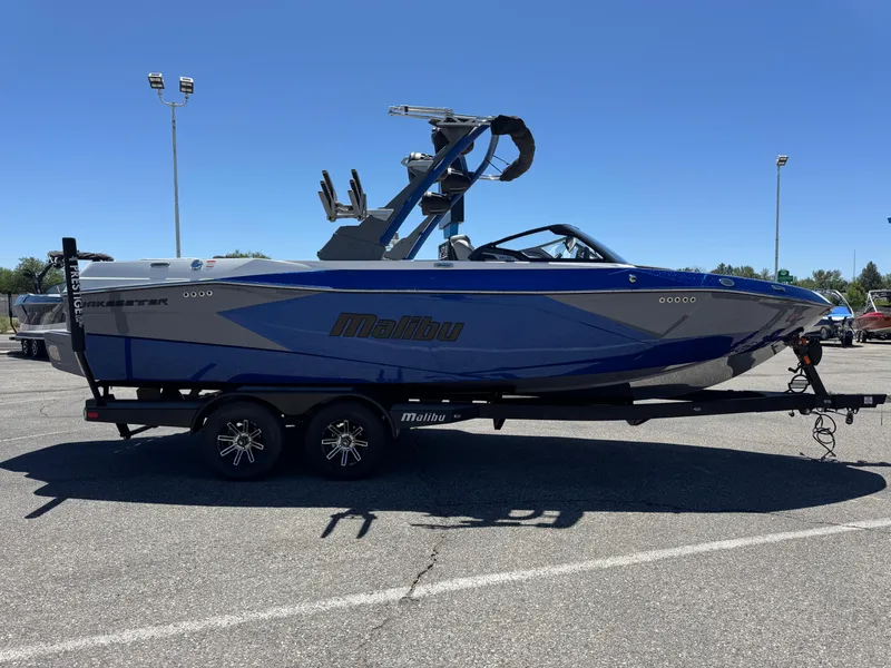 Slide: The Image of 2024 Malibu Wakesetter 23 LSV boat on trailer in parking lot, side view. - 4