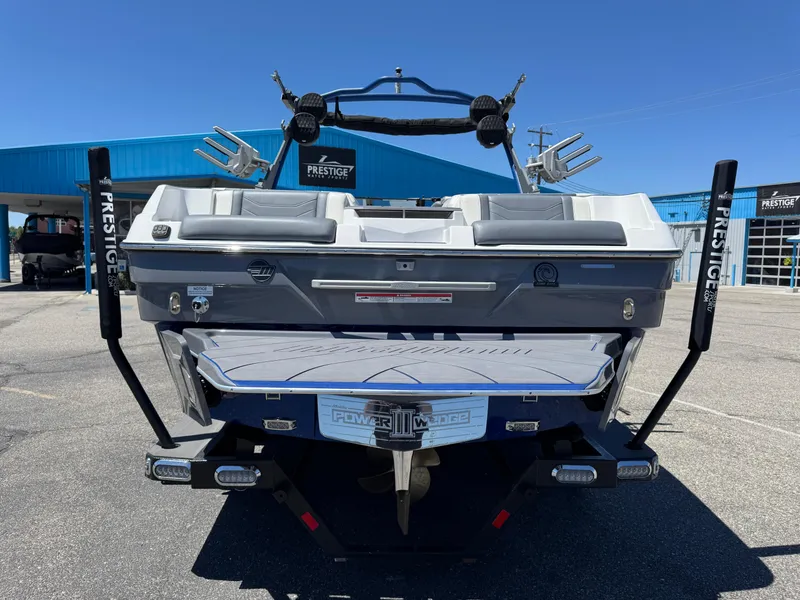 Slide: The Image of 2024 Malibu Wakesetter 23 LSV boat rear view at dealership. - 6