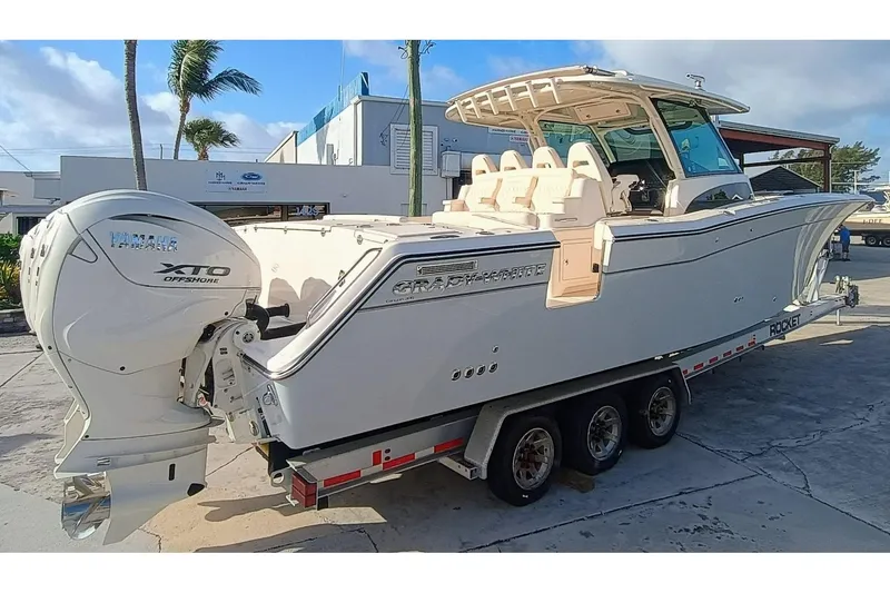 Slide: The Image of 2025 Grady-White Canyon 386 boat with Yamaha XTO engines on a trailer. - 7