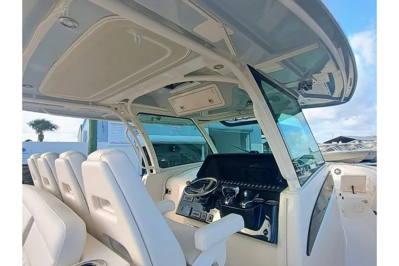 Slide: The Image of 2025 Grady-White Canyon 386 boat interior with modern helm and seating. - 8