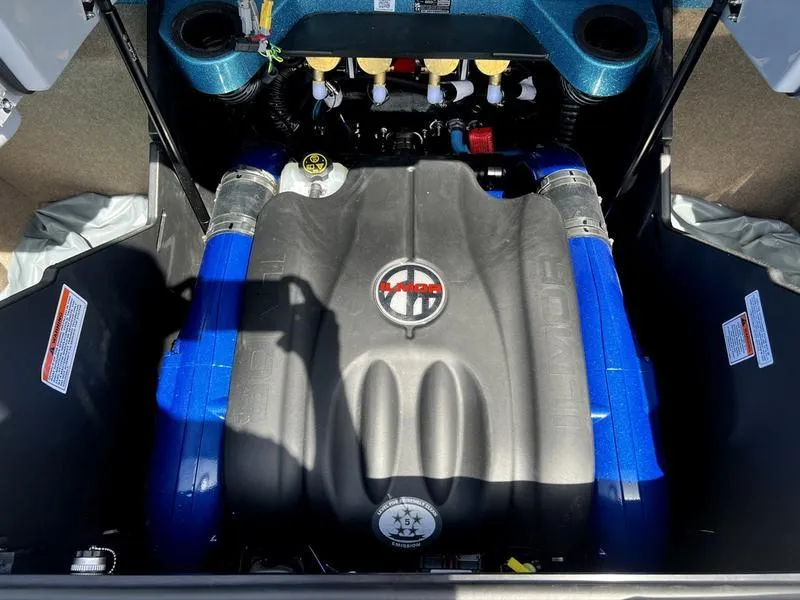 Slide: The Image of 2023 MasterCraft X24 engine compartment with blue accents and visible components. - 15