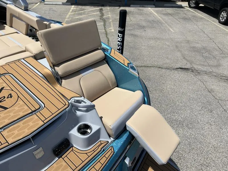 Slide: The Image of 2023 MasterCraft X24 boat with beige seating and teak-style decking. - 47