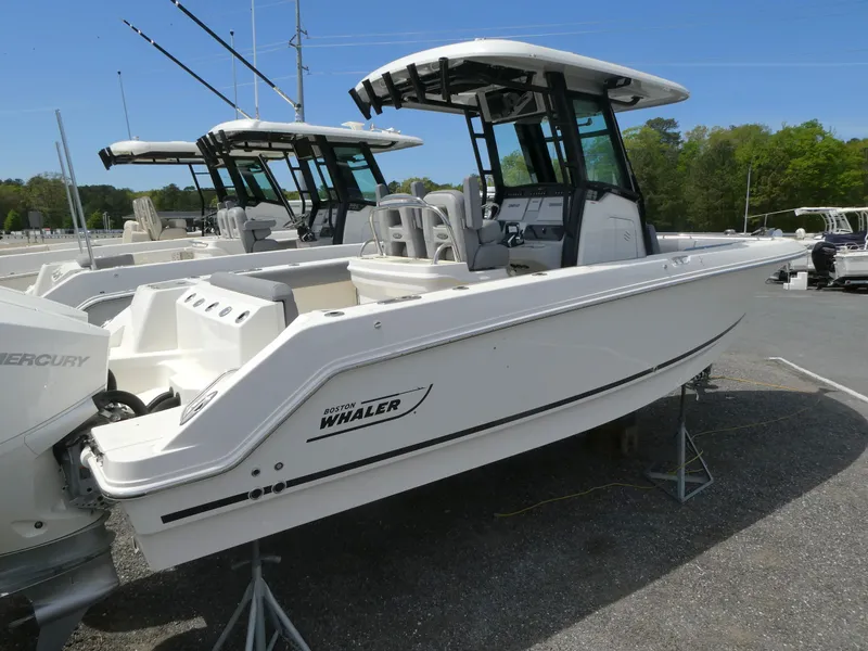 Slide: The Image of 2025 Boston Whaler 250 Outrage boat on display, featuring sleek design and modern amenities. - 1