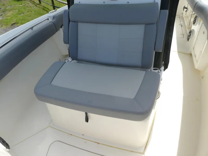 Slide: The Image of 2025 Boston Whaler 250 Outrage boat seat, gray upholstery, spacious and comfortable design. - 15