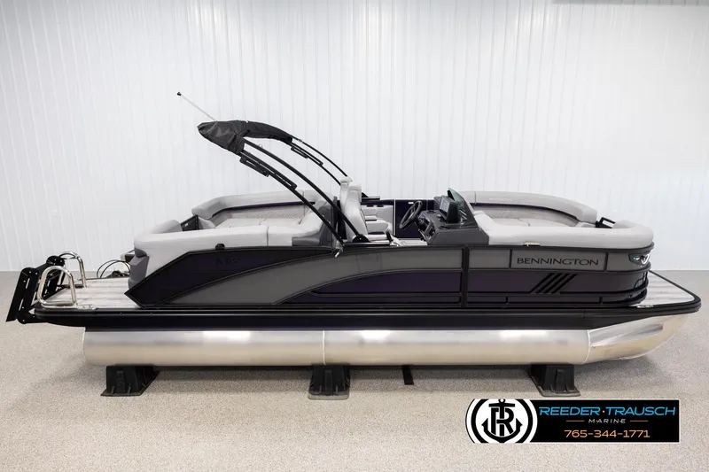 Slide: The Image of 2025 Bennington 22 MFBSE pontoon boat in showroom, side view. - 1