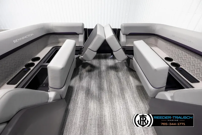 Slide: The Image of 2025 Bennington 22 MFBSE boat interior with gray seating and cup holders. - 16