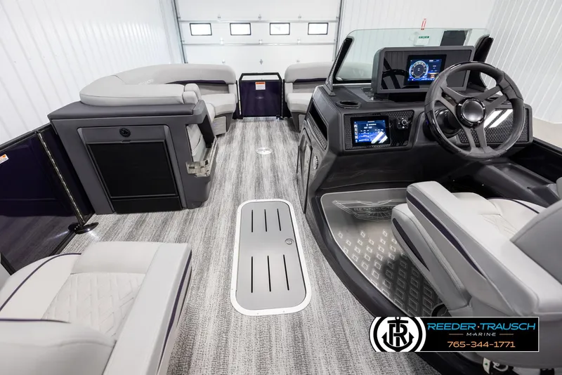 Slide: The Image of 2025 Bennington 22 MFBSE boat interior with modern dashboard and seating. - 18