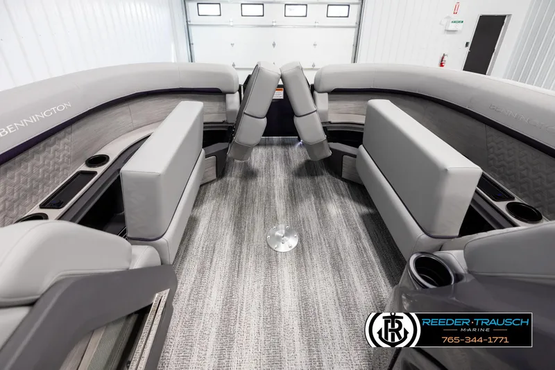 Slide: The Image of 2025 Bennington 22 MFBSE boat interior with gray seating and carpeted flooring. - 21