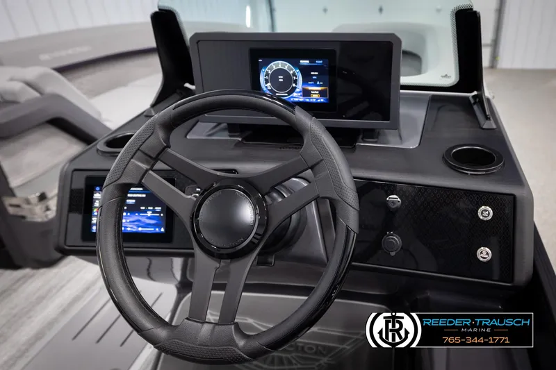 Slide: The Image of Steering console of 2025 Bennington 22 MFBSE boat with digital displays and controls. - 25