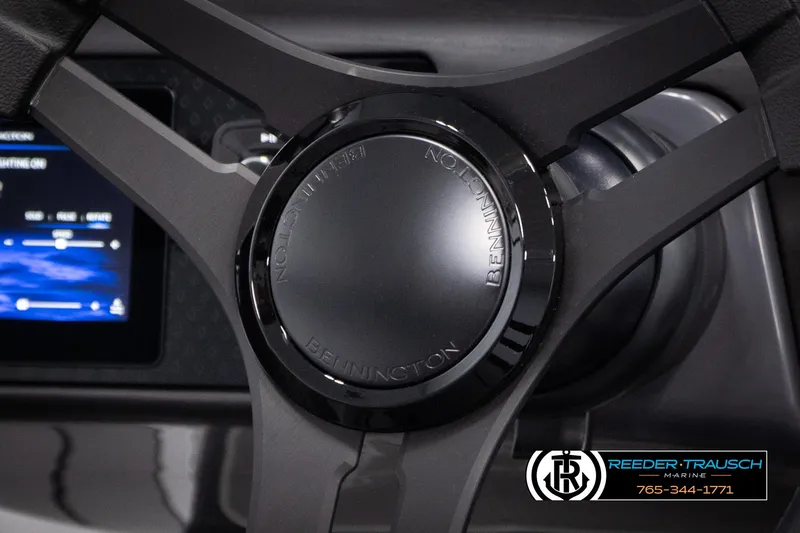 Slide: The Image of Steering wheel of 2025 Bennington 22 MFBSE boat with control panel in background. - 27