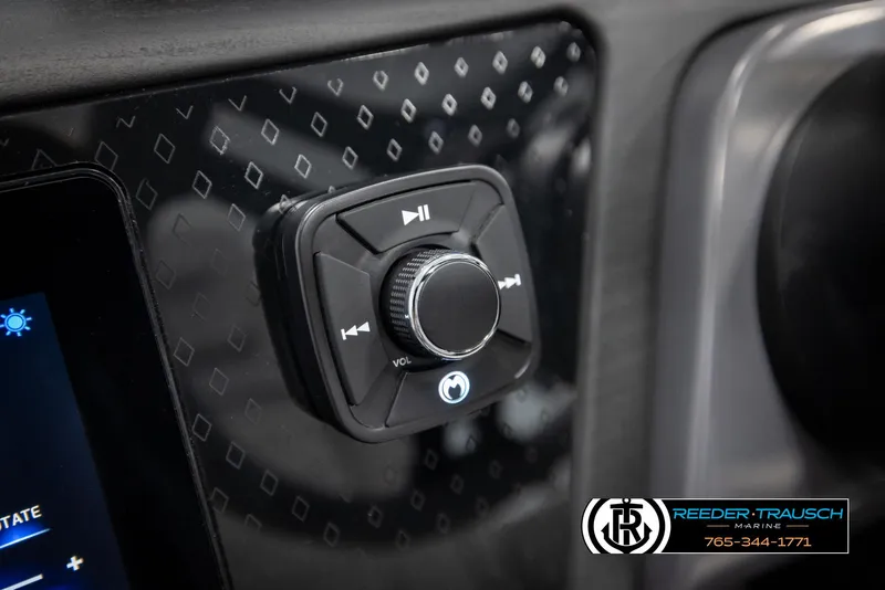Slide: The Image of Control panel of 2025 Bennington 22 MFBSE boat with volume and playback buttons. - 29