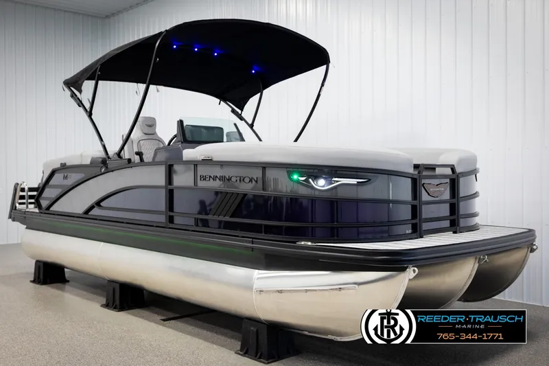 Slide: The Image of 2025 Bennington 22 MFBSE pontoon boat with canopy in showroom. - 3