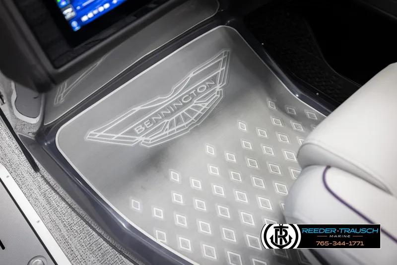 Slide: The Image of 2025 Bennington 22 MFBSE boat interior with branded floor mat and seating. - 38