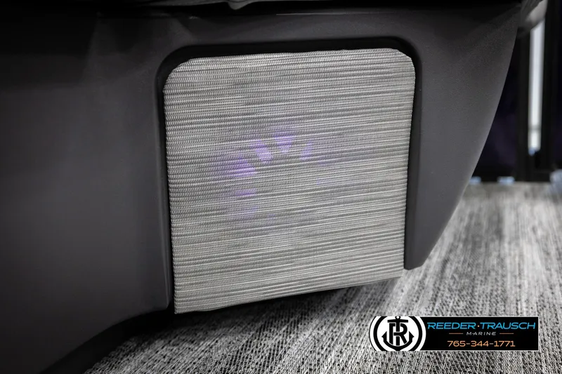 Slide: The Image of 2025 Bennington 22 MFBSE boat interior detail with textured panel and Reeder-Trausch Marine logo. - 41