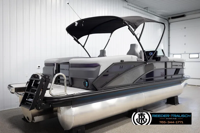 Slide: The Image of 2025 Bennington 22 MFBSE pontoon boat with canopy in showroom. - 6