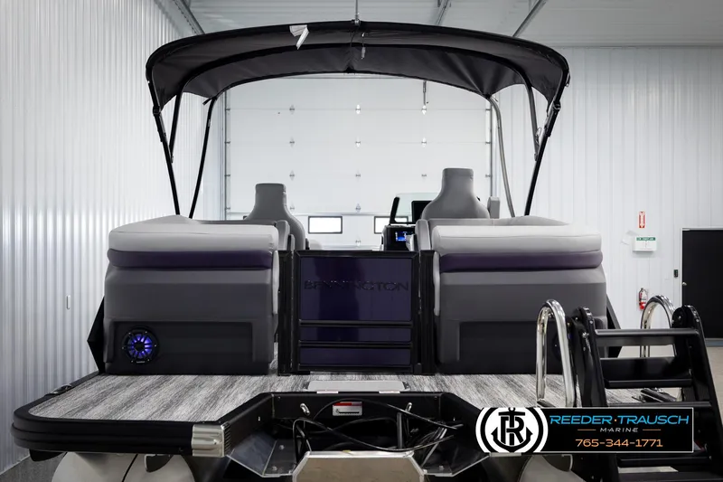 Slide: The Image of 2025 Bennington 22 MFBSE pontoon boat with canopy in a showroom. - 7