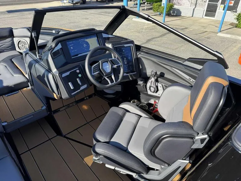 Slide: The Image of 2025 Supra SL boat interior with modern dashboard and comfortable seating. - 11