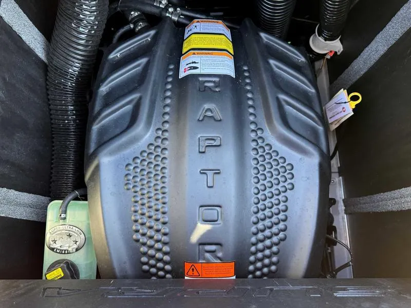 Slide: The Image of Engine compartment of a 2025 Supra SL with Raptor branding. - 16