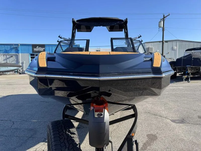 Slide: The Image of 2025 Supra SL boat on trailer, front view, in outdoor setting. - 4