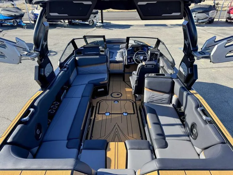 Slide: The Image of 2025 Supra SL boat interior with luxurious seating and advanced dashboard features. - 9