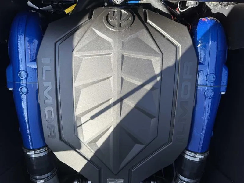 Slide: The Image of 2025 MasterCraft NXT22 Ilmor engine with blue accents, top view. - 14