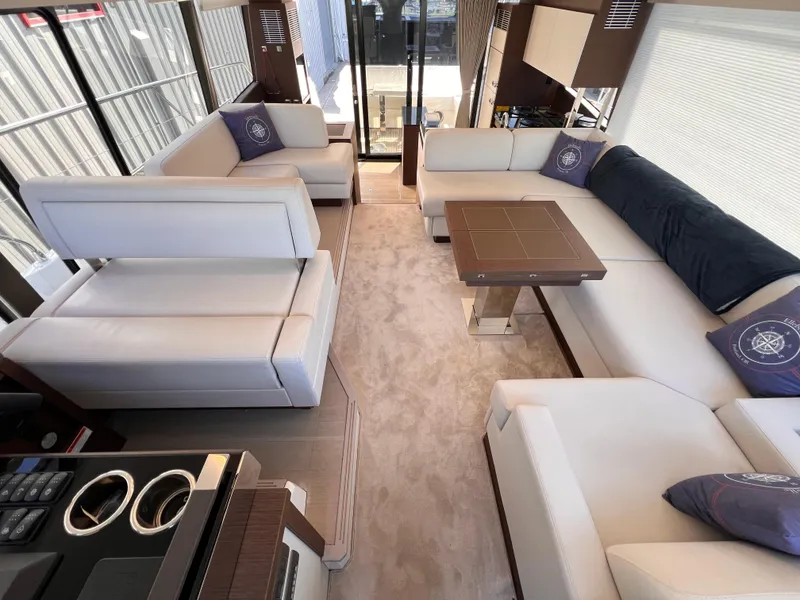 Slide: The Image of Luxurious interior of a 2023 Prestige 520 yacht with elegant seating and modern design. - 10