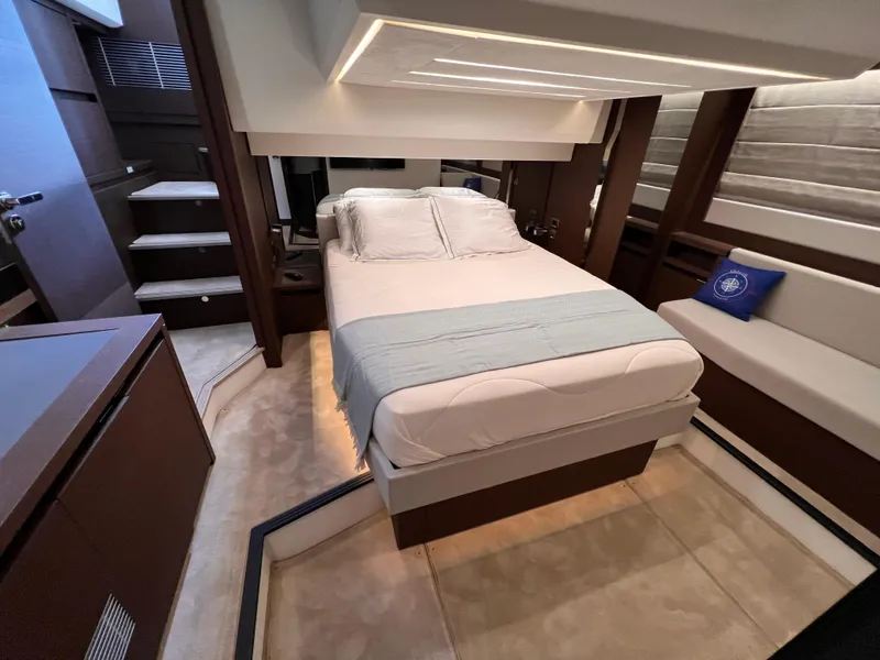 Slide: The Image of Luxurious bedroom interior of 2023 Prestige 520 yacht with modern design and cozy bedding. - 16