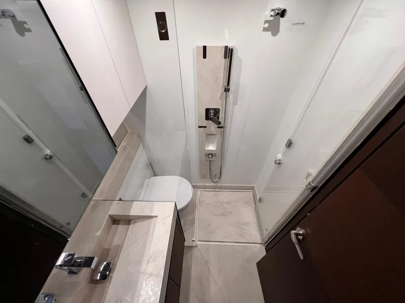 Slide: The Image of Modern bathroom in 2023 Prestige 520 yacht with sleek fixtures and compact design. - 18