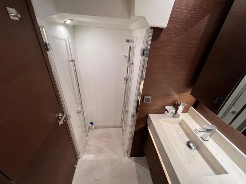 Slide: The Image of Modern bathroom in 2023 Prestige 520 yacht, featuring sleek design and elegant fixtures. - 22