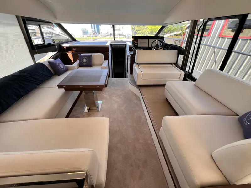 Slide: The Image of Luxurious interior of 2023 Prestige 520 yacht with elegant seating and modern design. - 8